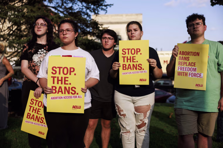 Abortion rights activists rally outside the Monroe County Courthouse in Bloomington, Ind., on Sept. 15, 2022.
