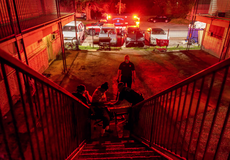 Image: Houston Fire Department EMS medics transport a Covid-positive patient to a hospital in Texas on Aug. 20, 2021. The Delta variant was overwhelming area hospitals.