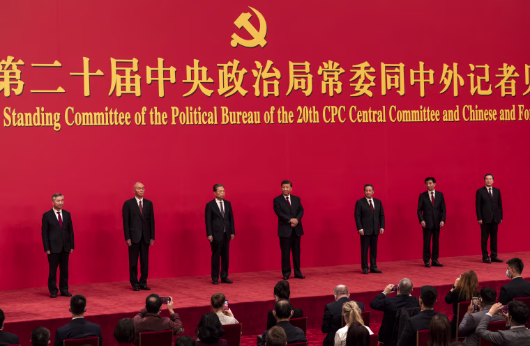 Members of the new Standing Committee of the Political Bureau of the Communist Party of China stand for a group photo at The Great Hall of People on October 23, 2022, in Beijing.