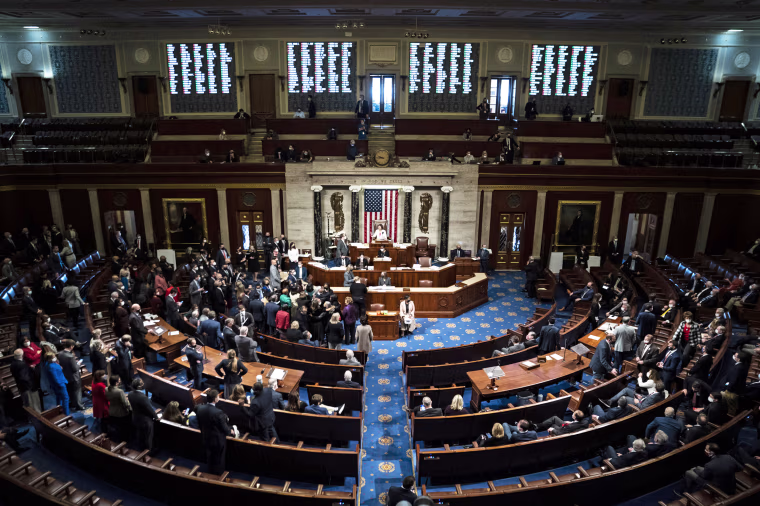 Members of Congress on the House floor at the Capitol 