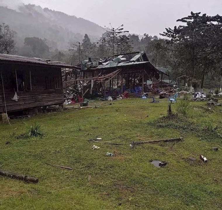 Debris is scattered around destroyed wooden structures Monday near Aung Bar Lay Village, Myanmar.