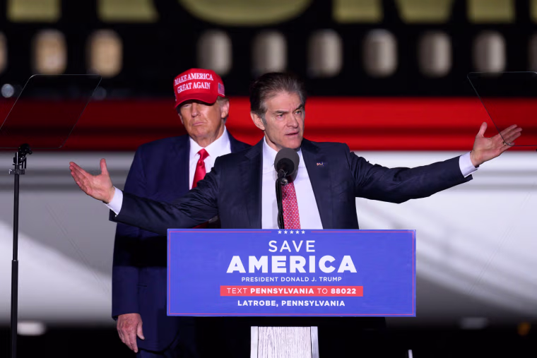 Former President Donald Trump looks on as Republican Senatorial candidate Mehmet Oz at Arnold Palmer Regional Airport in Latrobe, Pennsylvania, on November 5, 2022.