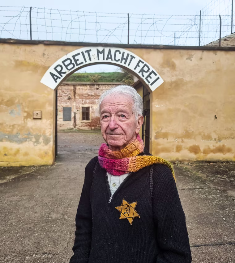 Gidon Lev at the gates to the courtyard of the small fortress of Theresienstadt, a Concentration camp in the Czech Republic, on Oct. 24, 2022