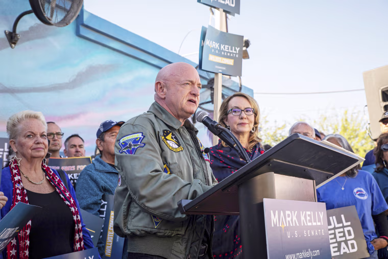 Sen. Mark Kelly speaks to supporters at the Barrio Cafe in Phoenix