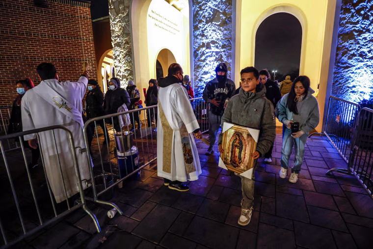 Image: Worshippers arrive for the annual festival dedicated to Our Lady of Guadalupe in Des Plaines, Ill., on Dec. 11, 2022.
