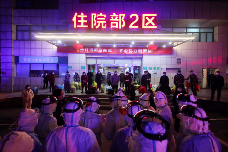 Medical workers prepare to transfer Covid-19 patients in Wuhan in central China's Hubei province on March 3, 2020.