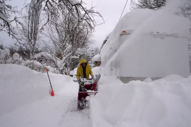 Paul Daruszka clears his driveway in Hamburg, N.Y., on Dec. 26, 2022. 