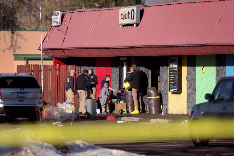 Law enforcement officials investigate at the Club Q nightclub