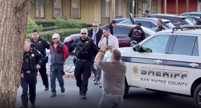 Chunli Zhao being arrested Monday in the parking lot of the San Mateo County Sheriff’s Office as a suspect in the mass shooting in Half Moon Bay earlier in the day.