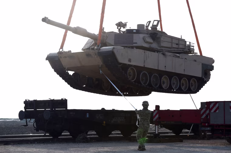 In this file photo taken on February 14, 2017, a US soldier helps to maneuver an Abrams tank from a railway car as US Army personnel offload military equipment at the Mihail Kogalniceanu Air Base near Constanta in Romania. - US President Joe Biden will address Americans on January 25, 2023, about US support for Ukraine, the White House announced, amid expectations that the US will announce future delivery of Abrams tanks. The White House gave no details of the remarks scheduled for 12:00 pm (1700 GMT), other than saying Biden "will deliver remarks on continued support for Ukraine."