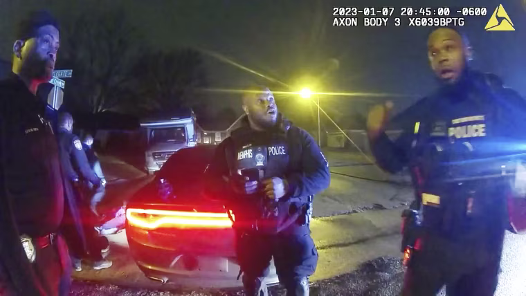 Police officers talk after the attack on Tyre Nichols during an arrest in Memphis, Tenn.