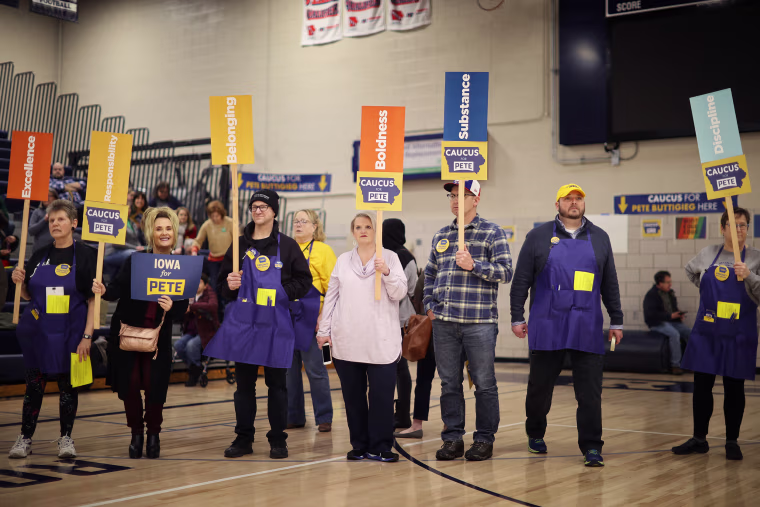 Supporters of Democratic presidential candidate Pete Buttigieg prepare to caucus for him in Des Moines, Iowa, on Feb. 3, 2020. 