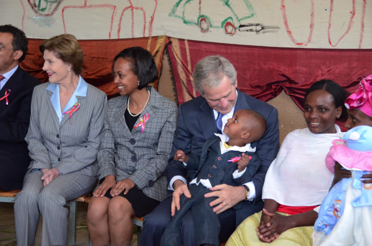 First lady Laura Bush and President George W. Bush at a PEPFAR site in Ethiopia in 2011.