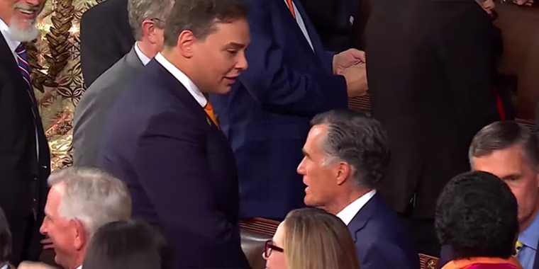 Rep. George Santos, R-N.Y., speaks with Sen. Mitt Romney, R-Utah, before the start of the State of the Union address at the U.S. Capitol on Tuesday.