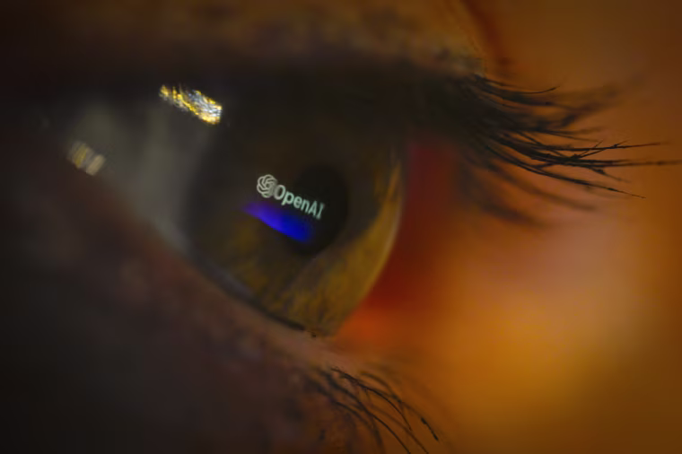 The OpenAI logo reflected in an eye.