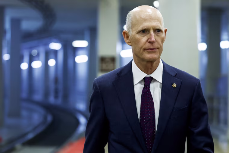 Rick Scott walks to a closed-door, classified briefing for Senators at U.S. Capitol