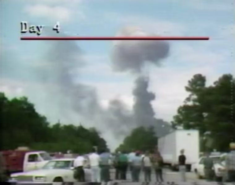 Image: A plume of smoke rises from the scene of a freight train derailment in Livingston, La., in 1982.