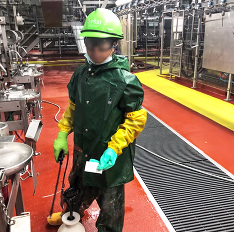A Department of Labor investigator photographed a child who worked for Packers Sanitation Services Inc. (PSSI) cleaning a slaughterhouse in Grand Island, Nebraska. The subject has been blurred by the source.