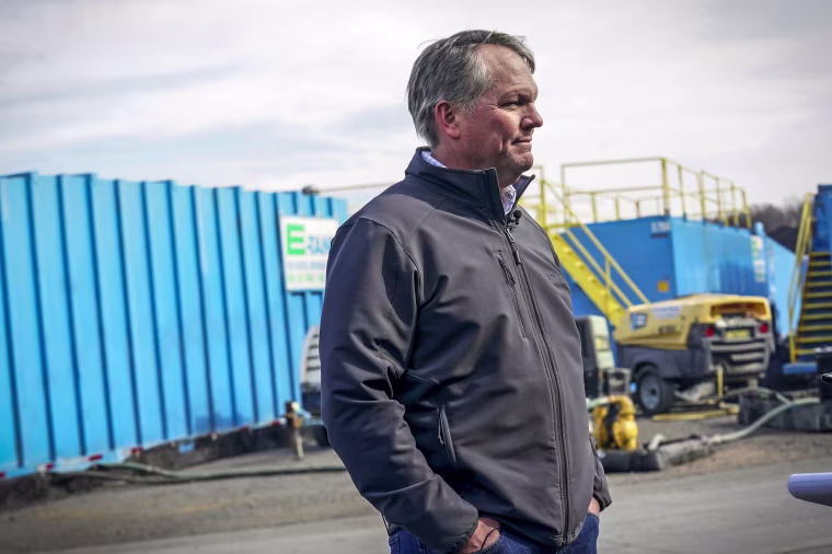 Image: Norfolk Southern President and CEO Alan Shaw speaks to reporters on Feb. 21, 2023, near the site where a freight train derailed Feb. 3 in East Palestine, Ohio.