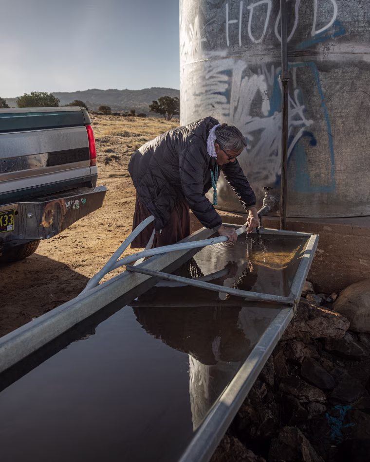 Marilyn Help-Hood, 66, has no running water at her small one-story home and needs to regularly replenish her supplies for drinking, cooking, washing dishes and feeding her small collection of sheep, horses and dogs.