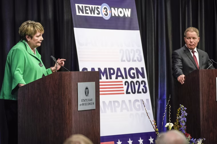 Image: Wisconsin Supreme Court candidates Republican-backed Dan Kelly and Democratic-supported Janet Protasiewicz participate in a debate on March 21, 2023, in Madison, Wis. 