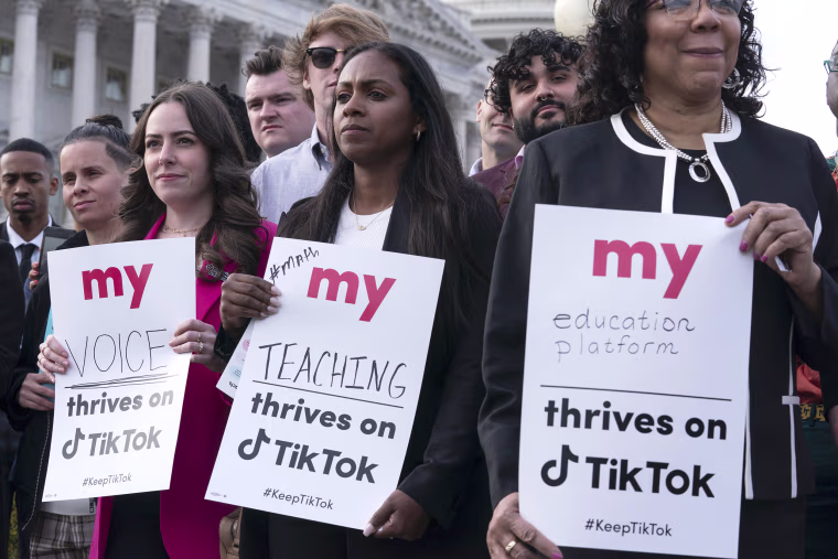 Supporters of TikTok hold signs during a rally to defend the app at the Capitol in Washington, Wednesday, March 22, 2023. The House holds a hearing Thursday, with TikTok CEO Shou Zi Chew about the platform's consumer privacy and data security practices and impact on kids.