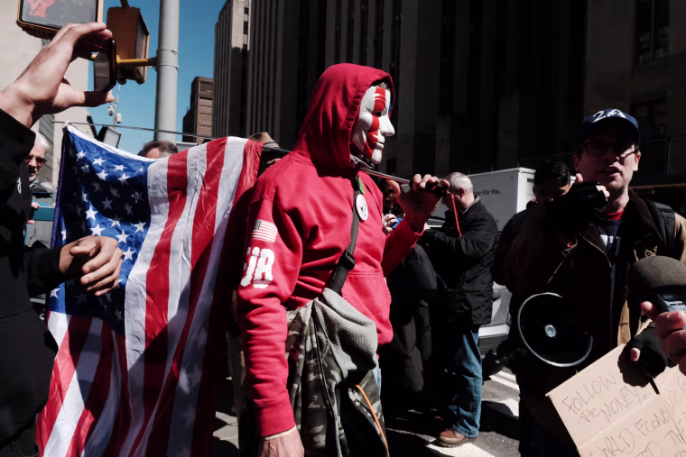 Trump supporters and critics gather outside of a courthouse in New York