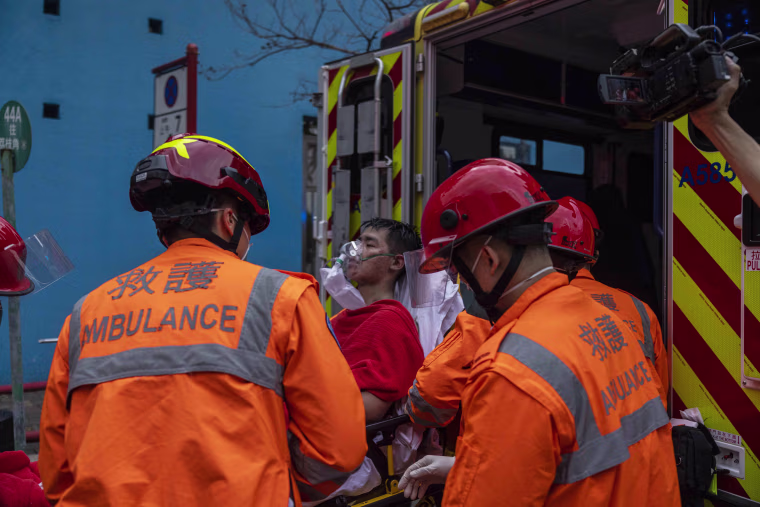 Hong Kong firefighters were battling a blaze Friday at a warehouse that forced more than 3,000 people to evacuate, including students, police said.
