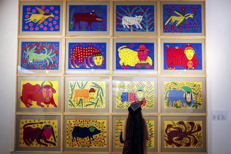 Works by Prymachenko that were rescued from Ivankiv on display in Lviv on Aug. 23, 2022.