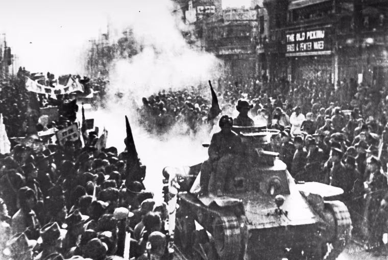 Tanks of the Chinese Communist army enter the streets of Beijing on May 2, 1949.