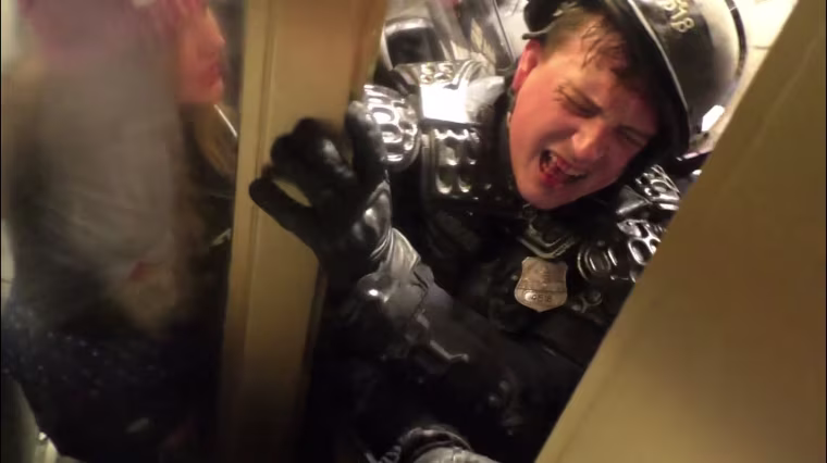Officer Daniel Hodges is crushed by rioters at the Capitol in Washington, D.C.