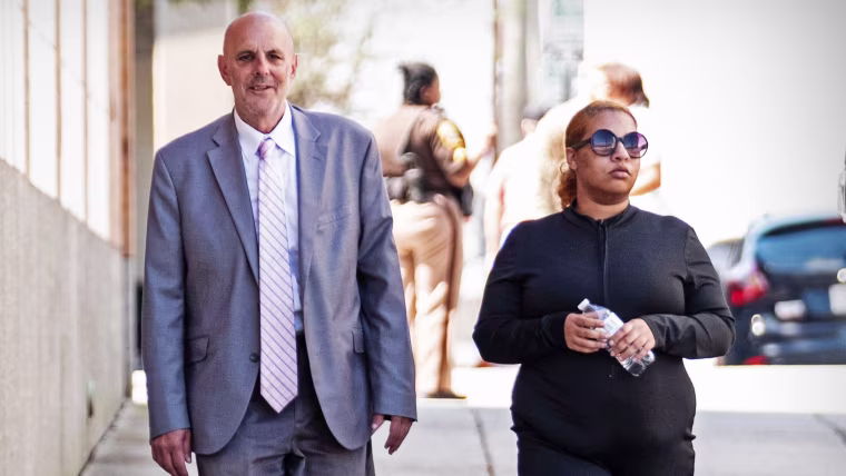 Deja Taylor arrives with attorney James Ellenson at the Sheriff's Office in Newport News, Va., on April 13, 2023, to turn herself in.