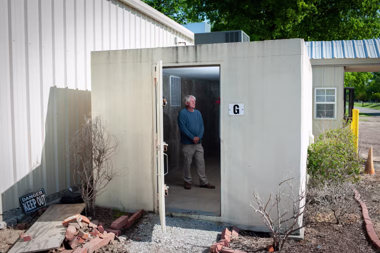 Police Chief Murry Roark stands inside the main tornado shelter in Boyle, Miss.