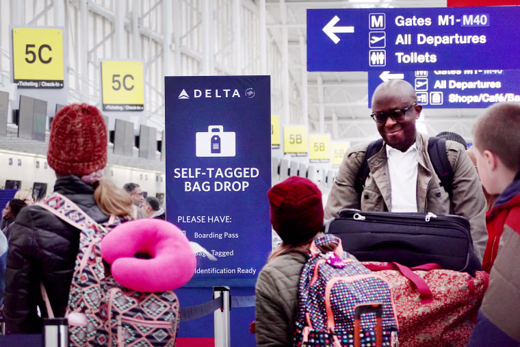 Passengers check in at Chicago’s O’Hare International Airport in January.