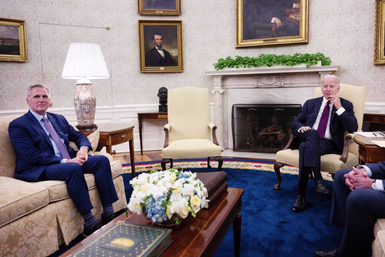 An empty chair next to President Joe Biden as he meets with House Kevin McCarthy in the Oval Office on May 9, 2023. 