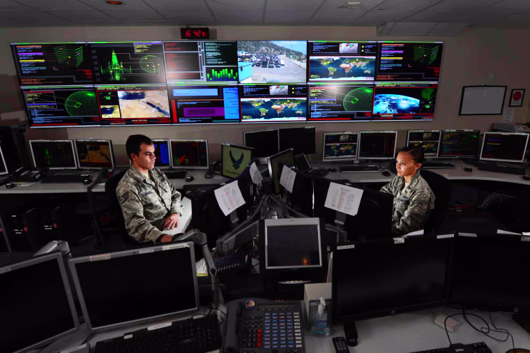 Staff Sgt. Alex Garviria and 2nd Lt. Rachel James work in the Global Strategic Warning and Space Surveillance System Center Sept. 2, 2014, at Cheyenne Mountain Air Force Station, Colo. Garviria is a 721st CS senior systems controller and James is the 721s