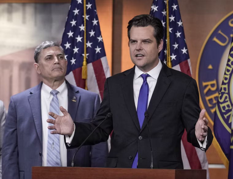 Rep. Matt Gaetz, R-Fla., speaks as Rep. Andrew Clyde, R-Ga., looks on at the Capitol on Nov. 17, 2022.