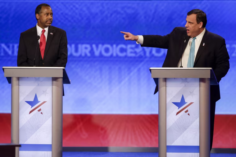Republican presidential candidate New Jersey Gov. Chris Christie points toward Republican presidential candidate Sen. Marco Rubio, R-Fla., at the other end of the stage during a debate in Manchester, N.H., on Feb. 6, 2016.