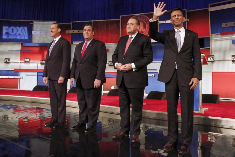 Republican presidential candidates Rick Santorum, Chris Christie, Mike Huckabee and Bobby Jindal take the stage during the Republican presidential debate in Milwaukee on Nov. 10, 2015.