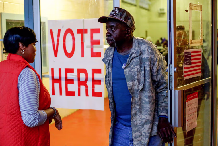 Voters exit a polling station in Camden, Ala., on March 3, 2020.