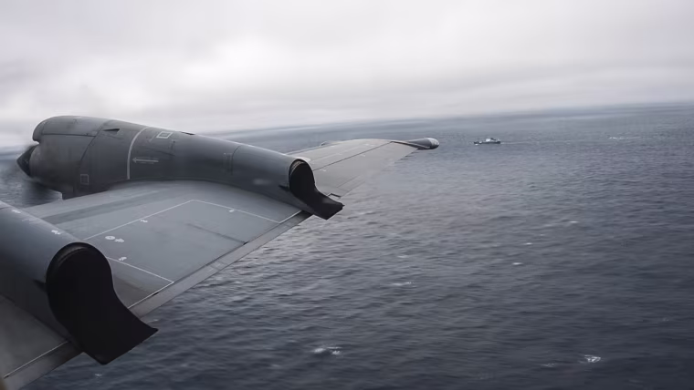 In a still image from video, the Royal Canadian Air Force CP-140 Aurora maritime surveillance aircraft of 14 Wing flies a search pattern for the missing OceanGate submersible in the Atlantic Ocean off Newfoundland, Canada on June 20, 2023.