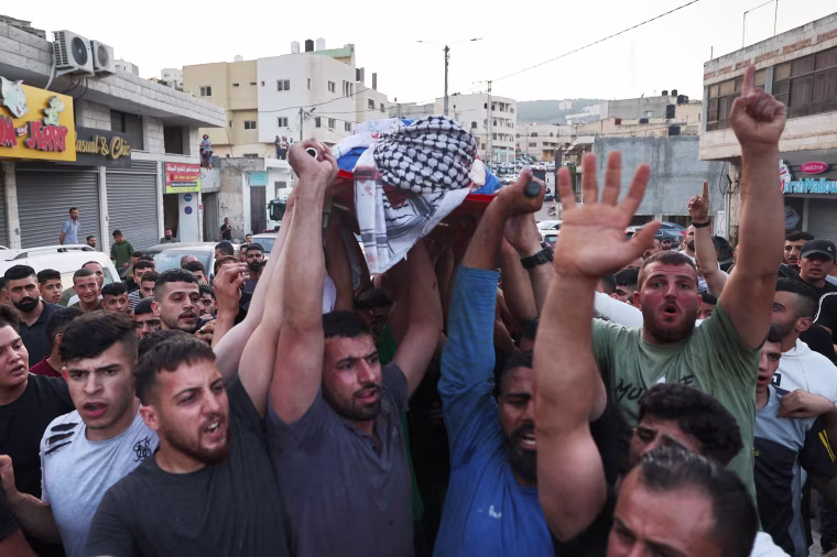 Four people were shot dead on June 20 near the settlement in the occupied West Bank, Israeli officials said, a day after an army raid left six Palestinians dead.