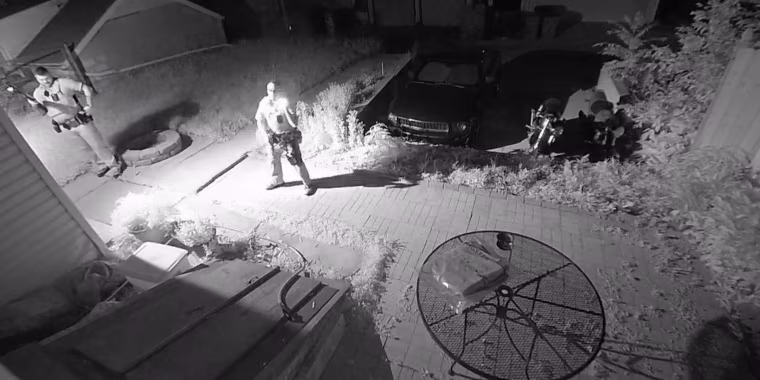 Police respond at the house of Patrick Tomlinson in Milwaukee.
