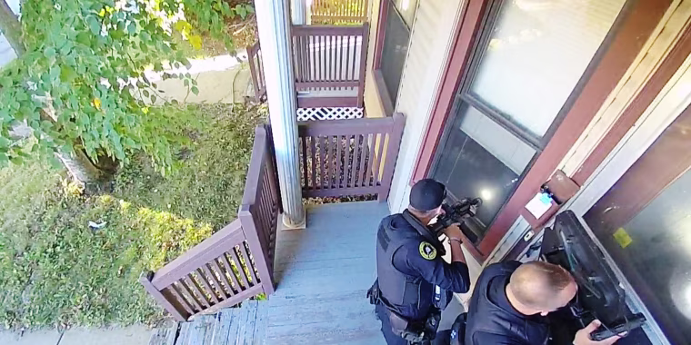 Police respond at the house of Patrick Tomlinson in Milwaukee.