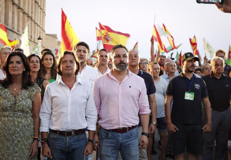 Vox party leader Santiago Abascal, center, listens to the national anthem during a campaign event in Palma de Mallorca on July 14, 2023.