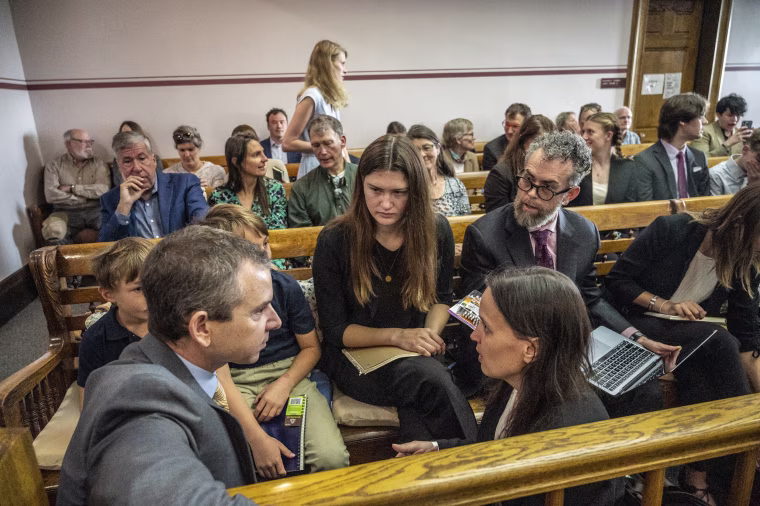 Rikki Held and the Our Children's Trust legal team confers at the the nation's first youth climate change trial in Helena, Mont.