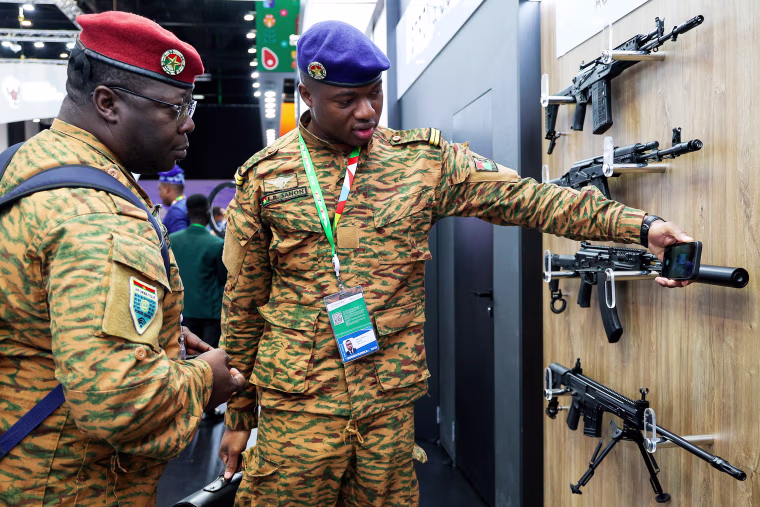 Members of delegations examine a weapon exhibition on the sideline of the Russia Africa Summit in St. Petersburg, on July 28, 2023.
