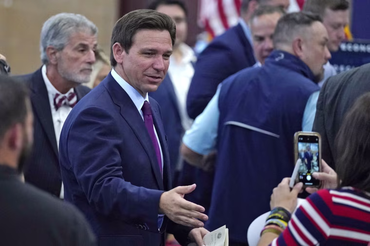 Florida Gov. Ron DeSantis shakes hands during a campaign event, Monday, July 31, 2023, in Rochester, N.H.