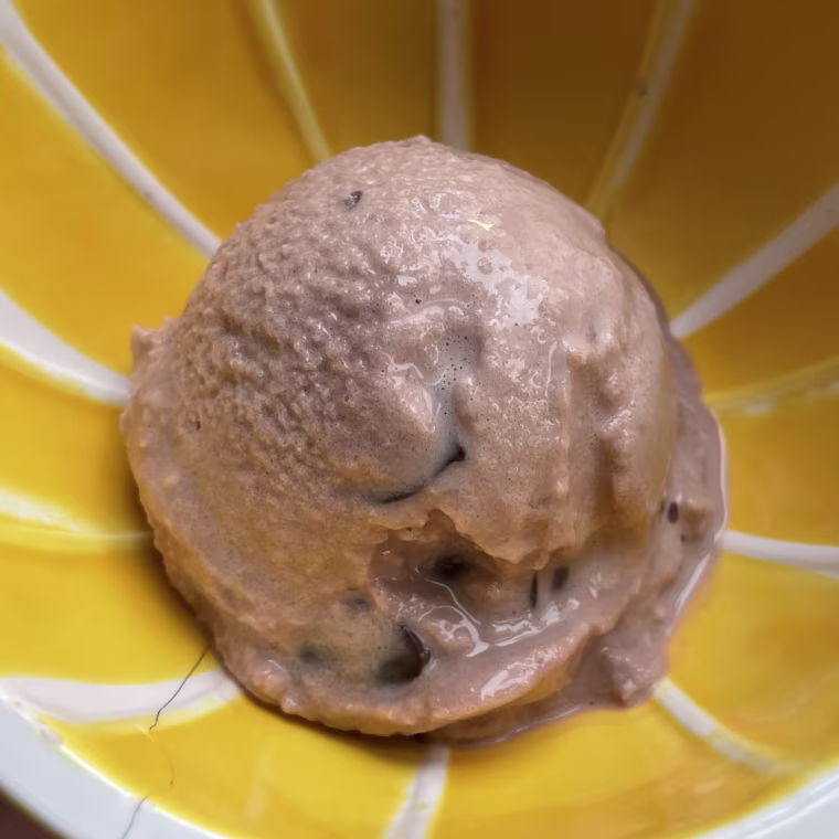 NBC Select associate updates editor Zoe Malin used the Ninja Creami’s lite ice cream program to make a frozen treat from almond milk and chocolate protein powder. She added chocolate chips with the appliance’s mix-ins functionality.