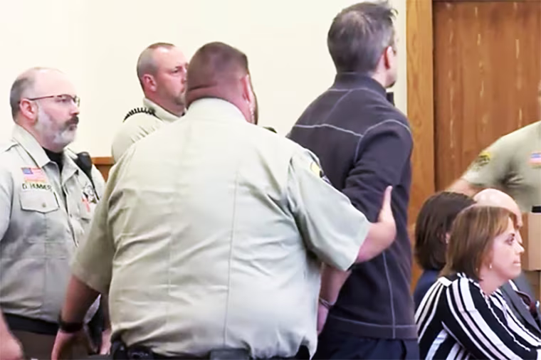 Timothy Bliefnick is handcuffed in court after being found guilty in Adams County, Ill., on May 31, 2023.